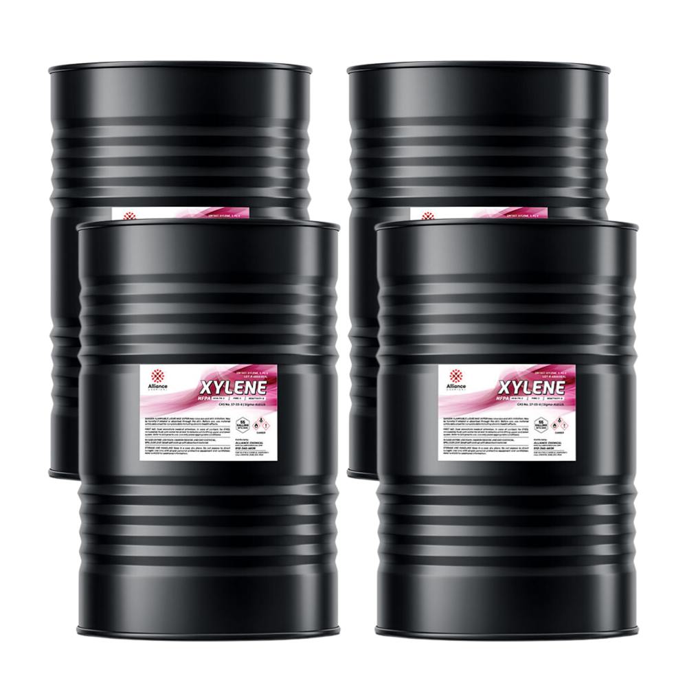 Four 55-gallon steel drums of Alliance Chemical Xylene with black bodies and product labels.