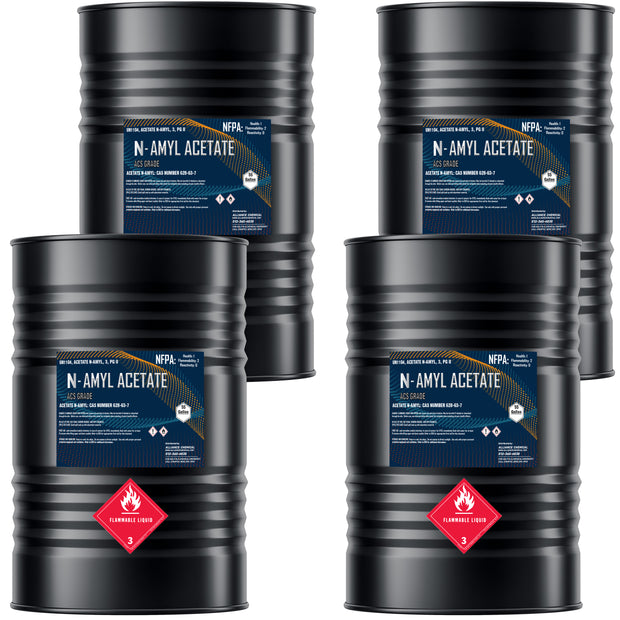 Four 55-gallon steel drums of Alliance Chemical Amyl Acetate ACS Grade with blue labels and ribbed exteriors.