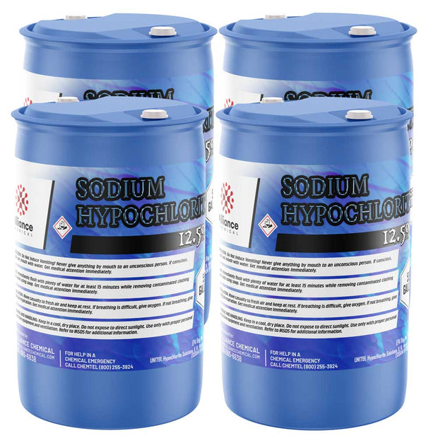 Four 55-gallon plastic drums of Alliance Chemical Sodium Hypochlorite 12.5% with blue lids and safety labels.
